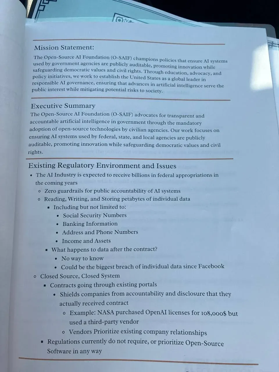 Printed AI policy document with mission statement and regulatory issues for open-source government AI accountability Printed AI policy document with mission statement and regulatory issues for open-source government AI accountability