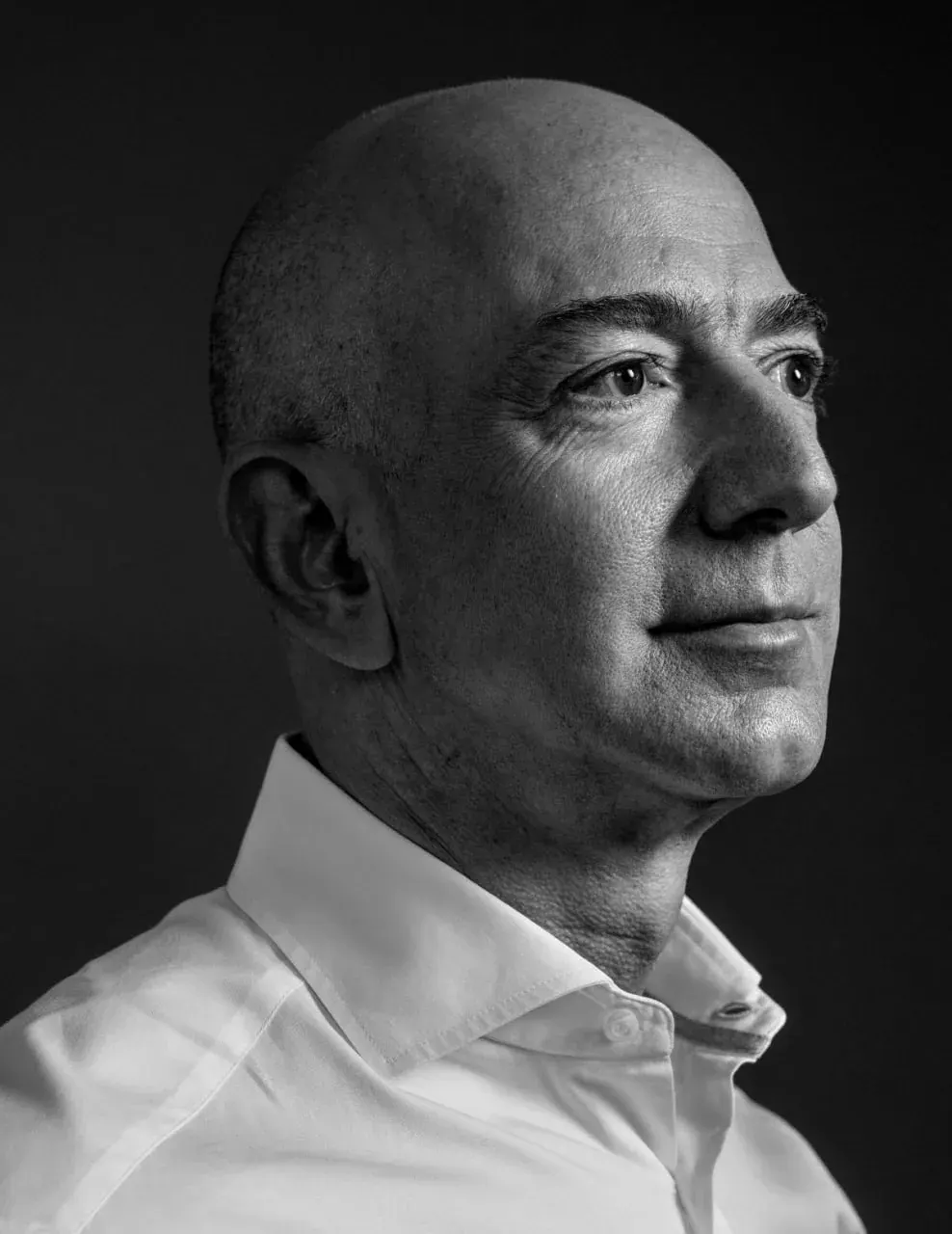 Portrait of a bald man in a white collared shirt for a SaaS contracts legal page